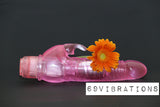 A pink Crystal Climbing Rabbit Vibrator, complete with an attached flower, is set against a black background. In the corner, the text "69VIBRATIONS" is displayed, showcasing products from a sex toy shop in Nairobi.